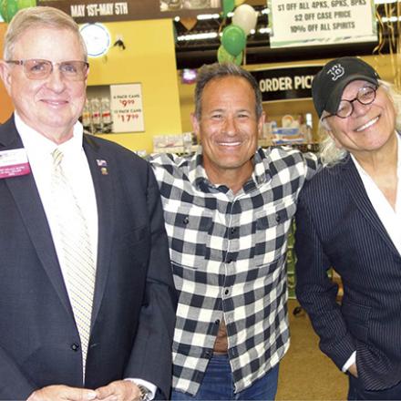 (left to right) Jack Riddle, Sam Calagione, and Alex Pires at Outlet Liquors